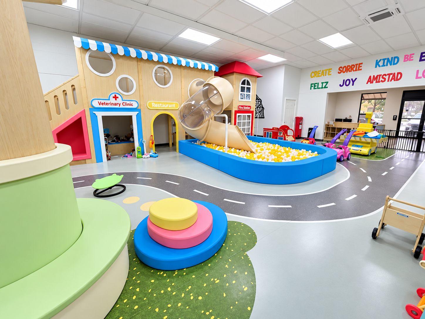 Little Haines City: an indoor play space with a miniature town, ball pit, and painted roadways