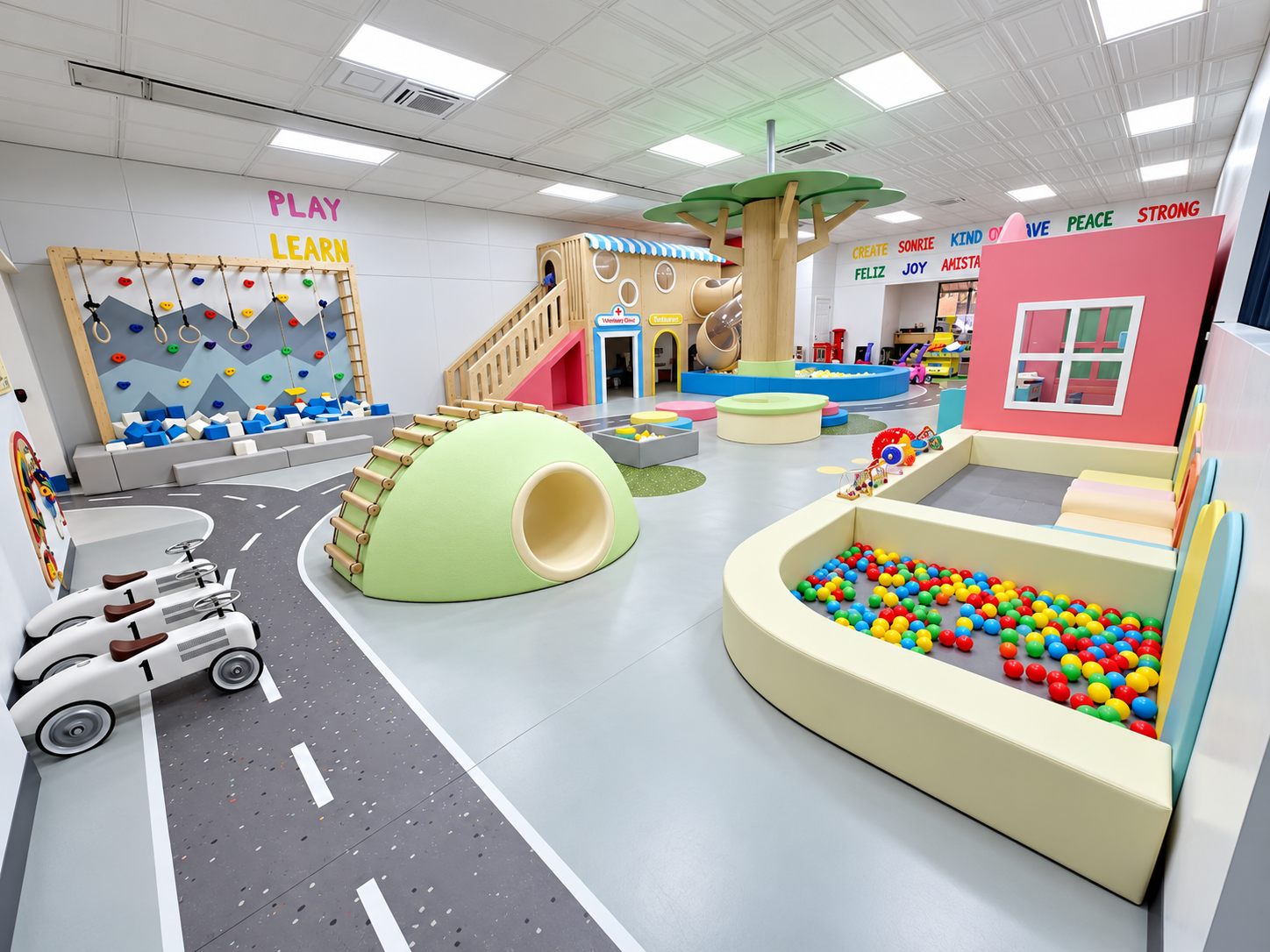 Climbing wall, soft dome, and ball pit along the painted road