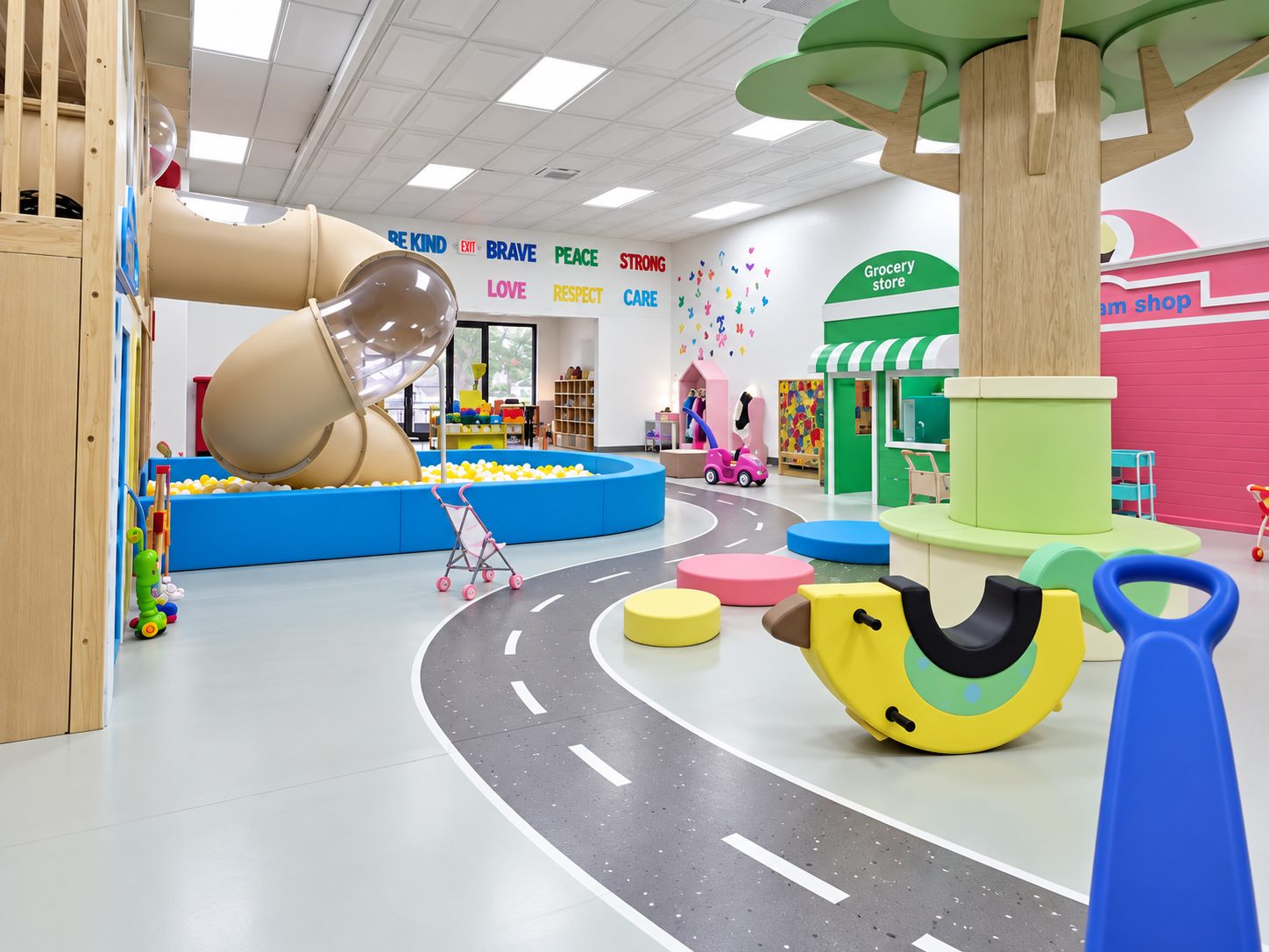 Slide and playhouse beside the ball pit